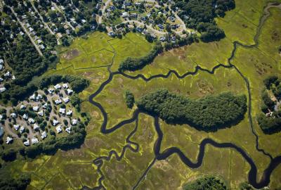 Aerial view of subdivisions next to wetlands along the Connecticut River in Old Saybrook, Connecticut.