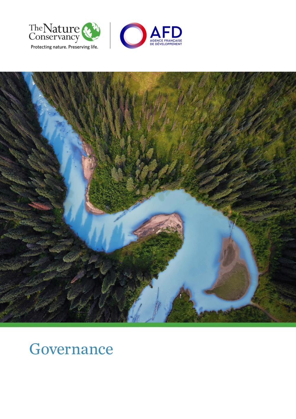 Cover shows aerial view of river flowing through thick coniferous forest