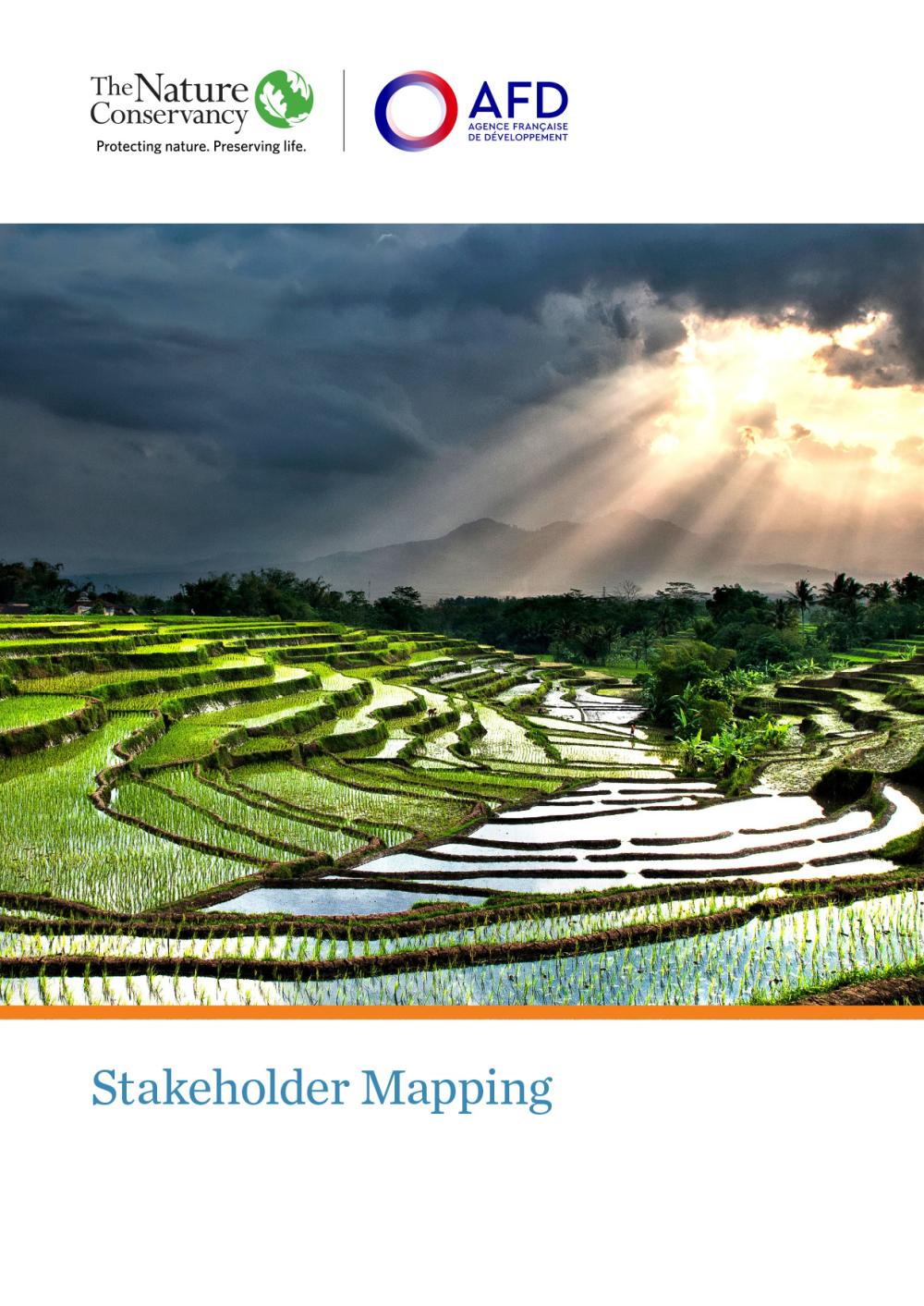 Cover shows sun peeking through dark clouds over rice fields
